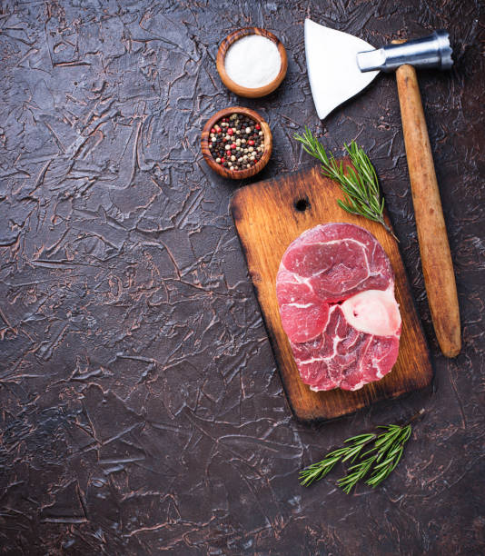 istock Raw meat osso buco and butchers axe 925055066