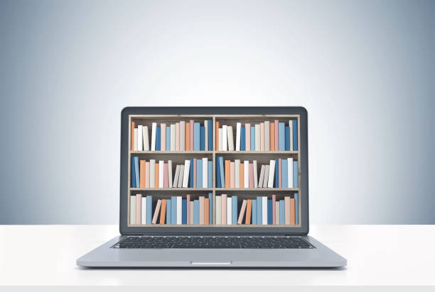 istock Laptop with bookshelves on screen, white desk 925055574