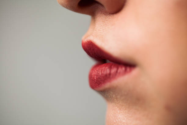 istock Close-Up of Young Woman's Red Lips 925056308