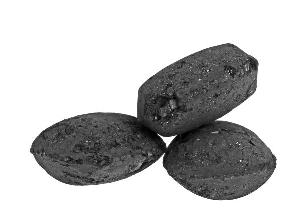 istock Charcoal briquettes on white background 925056328
