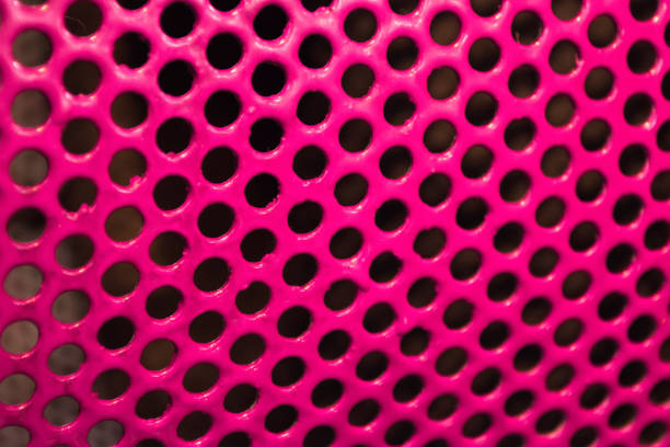 Texture metallic painted with pink glossy paint with black holes-glamorous triphofobia