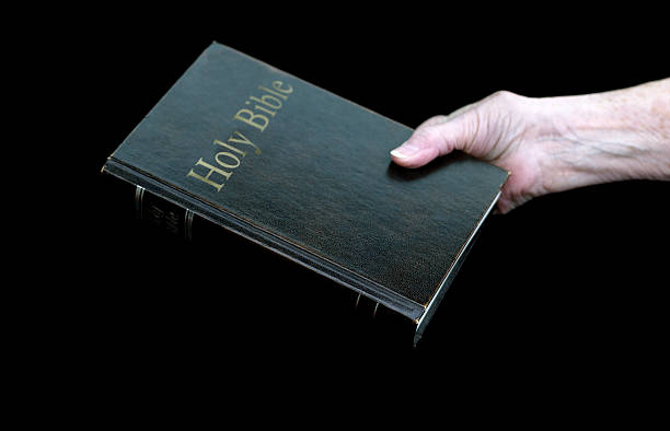istock Aged Female Hand with Bible 92506128