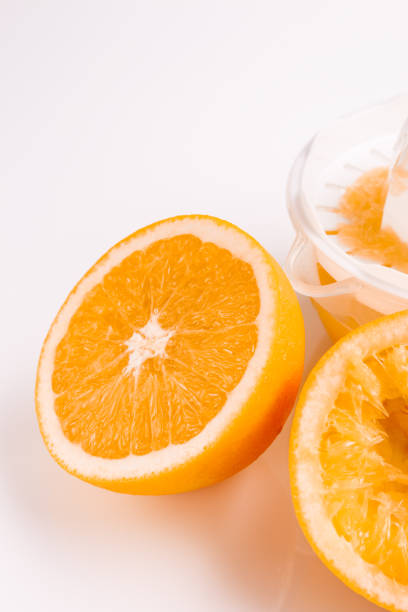 istock oranges and juice on a white background 925063964