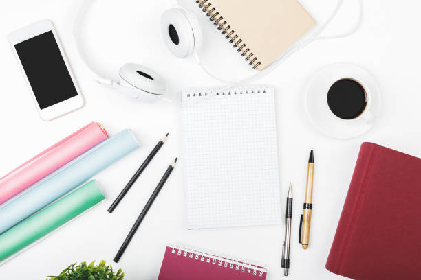 istock Creative white desk top with blank cellphone 925064010