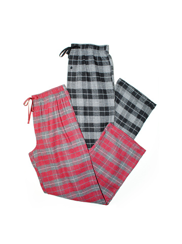 Red and black plaid pajama pj pants on a white background