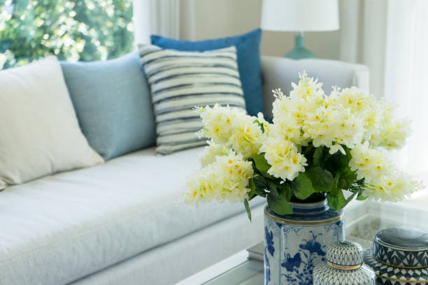 istock classic gray sofa and navy blue pillows by the window in living corner 925065912