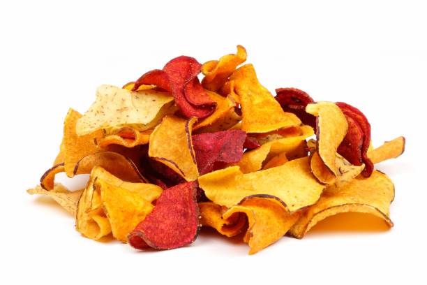 istock Pile of healthy vegetable chips, side view, isolated on white 925066296