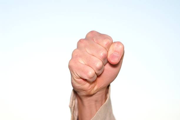 istock hand in fist 92506637