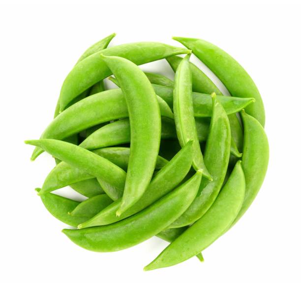 Pile of snap peas, above view isolated on white stock photo