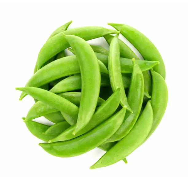 Pile of fresh snap peas. Above view isolated on a white background.