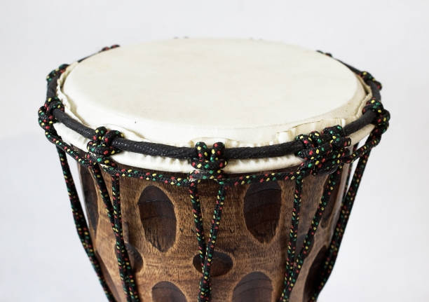 istock Wooden hand drum on a monophonic, white background.  Close-up. 925071608