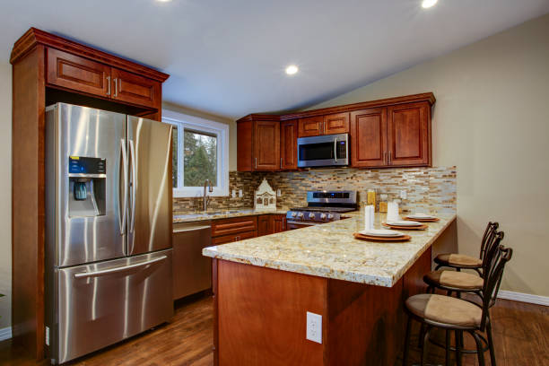 istock Brown kitchen design with mahogany kitchen cabinets. 925072240