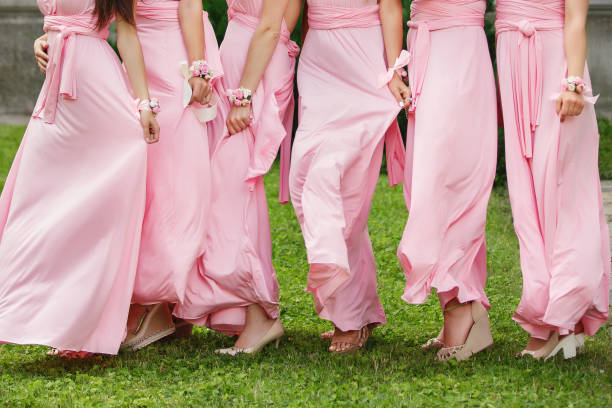 istock Bridesmaids pink dresses for stylish wedding 925078878