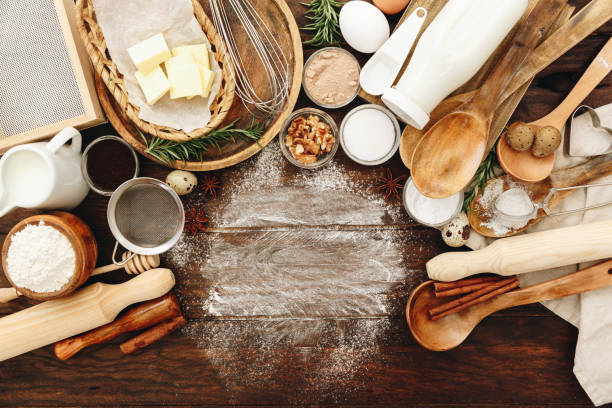 istock Ingredients for baking. Flour, eggs, sugar on wooden background 925079064
