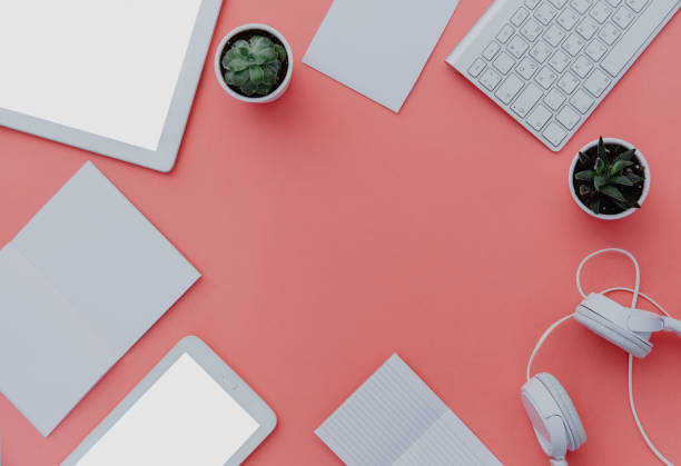 istock Flat Lay of keyboard with office supplies and digital tablet workspace, office table, top view. Copy space over pastel background 925079898