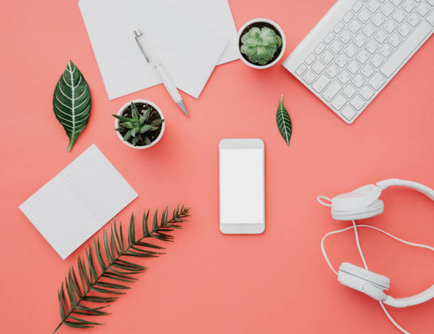 istock Mockup of smartphone with white screen on pastel background. Flat lay, top view workspace 925080072