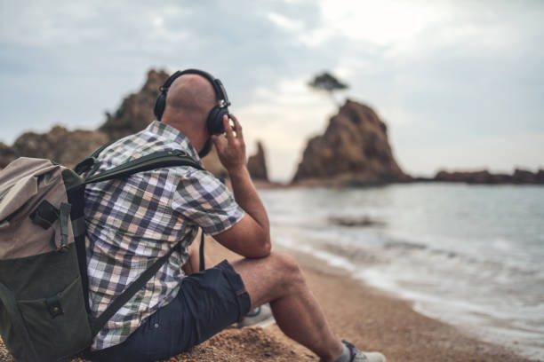 istock Solitude with a music on the beach 925082248