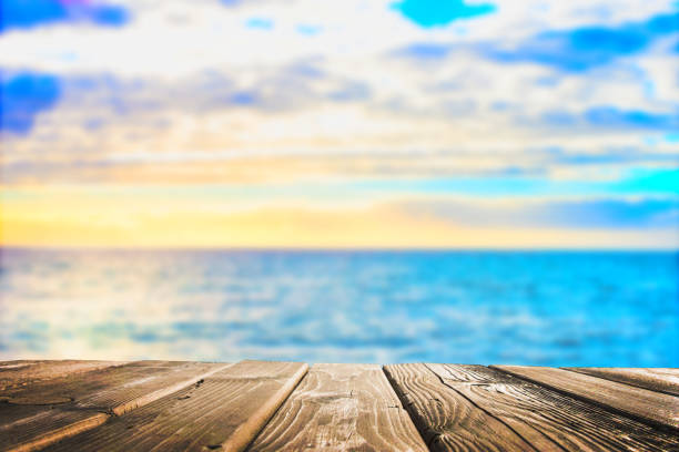 istock Wooden table top on blue sea and white sand beach 925083988