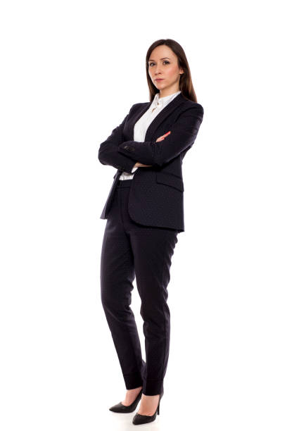 istock Serious businesswoman standing on white background 925084872