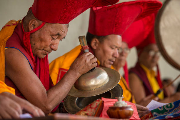 Buddhist lamas (head monks) making music during festival Phyang, India - July 15, 2015: Buddhist monks (lamas) are performing music and prayers during the festival in 
 lama religious occupation stock pictures, royalty-free photos & images