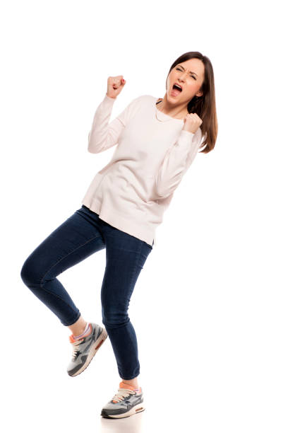 istock Young excited woman with winning gesture on white backgeound 925087406
