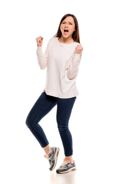 istock Young excited woman with winning gesture on white backgeound 925087412