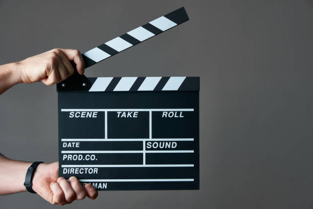istock Hands with a movie clapperboard 925087820