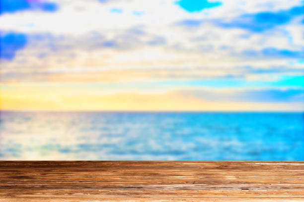 istock Wooden table top on blue sea and white sand beach 925088060