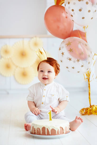 happy infant baby boy celebrating his first birthday