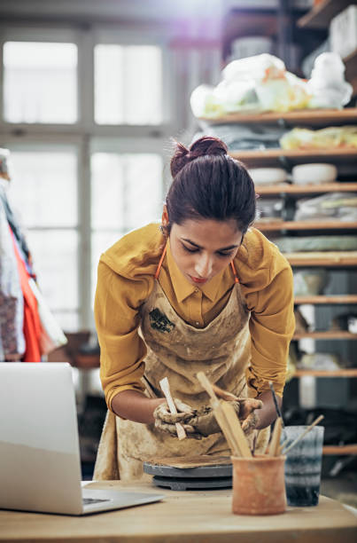 istock Close-Up Of Woman Potter Working At Table 925092224