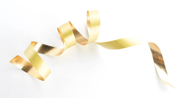 istock Golden ribbon roll isolated on white background 925092374