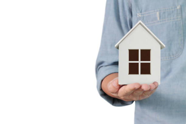 istock Mortgage concept by house from hand 925092968
