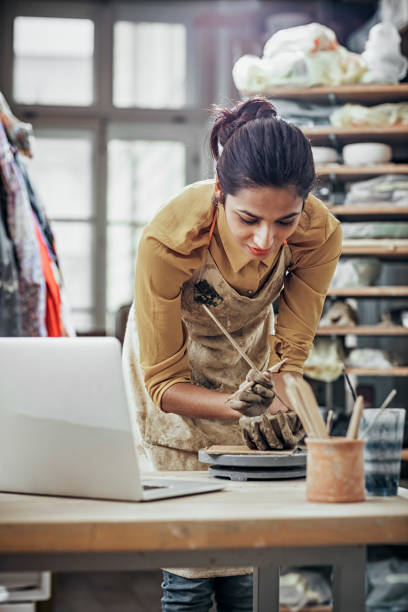 istock Close-Up Of Woman Potter Working At Table 925093052