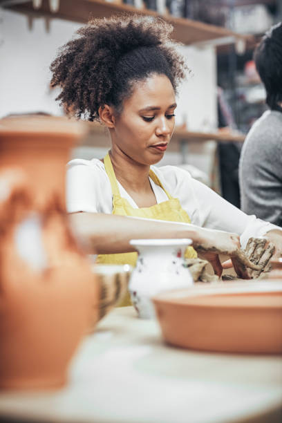istock Close-Up Of Woman Potter Working At Table 925093414