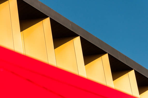 istock Blue sky red and yellow wall abstract background 925093460