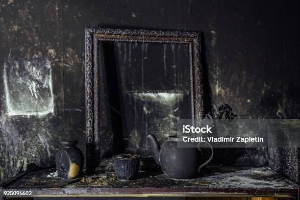 Burnt Room Interior Burnt Still Life Charred Wall Picture Frame Pot With Burned Rose In Black Soot Stock Photo - Download Image Now