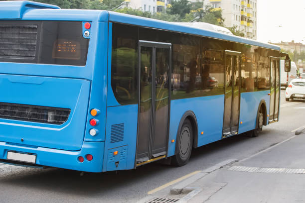 istock bus goes along street 925097150