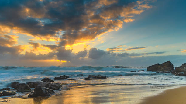 istock Surfs Up! - Rocky Sunrise Seascape 925103784