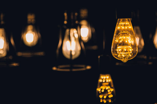istock old retro vintage light bulb hanginh from ceiling with back background 925104150