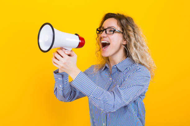 istock Woman in shirt with loudspeaker 925104418