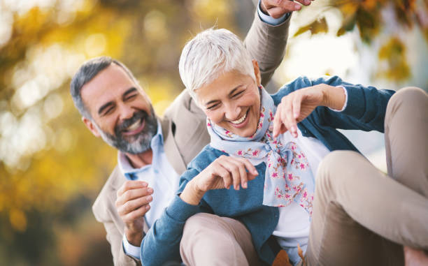 istock Mid aged couple in a park 925107606
