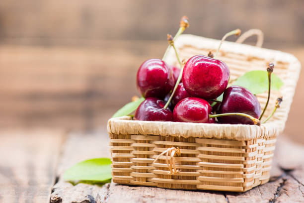 istock Fresh Cherry from farm, sweet and sour fruit, wooden table background 925107794