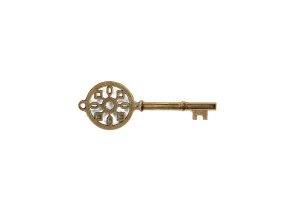 Image of an antique key with beautiful ornate, isolated on white background