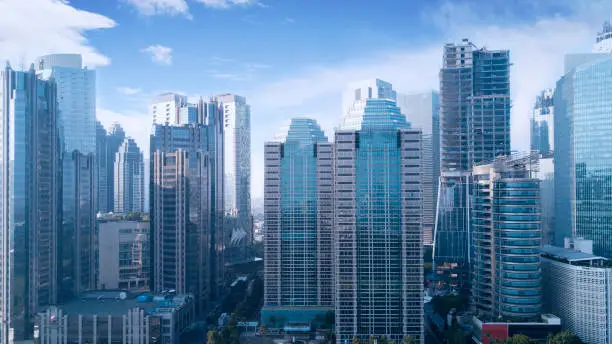 Beautiful aerial view of office buildings under blue sky in Jakarta, Indonesia