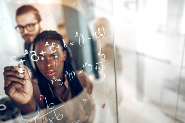istock Writing Mathematical Formulas On Transparent Wipe Board 925115186