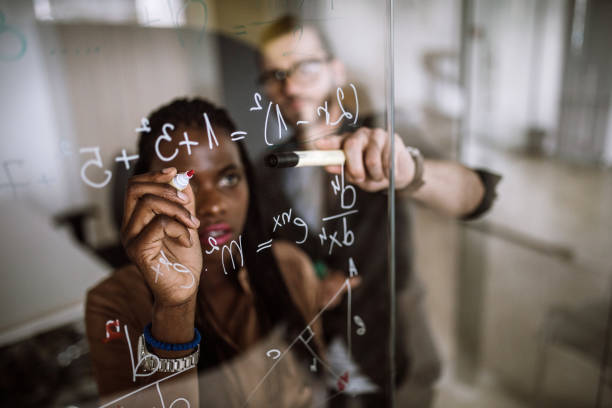 istock Writing Mathematical Formulas On Transparent Wipe Board 925115724