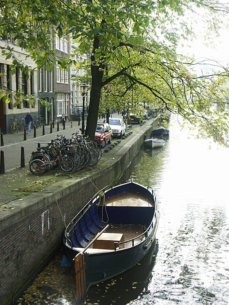 amsterdam: canal with boat stock photo