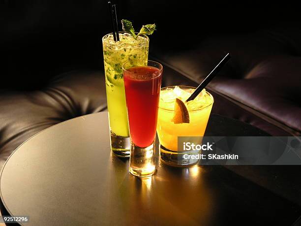 Three Cocktails On A Modern Side Table Stock Photo - Download Image Now - Alcohol - Drink, Appetizer, Bar - Drink Establishment