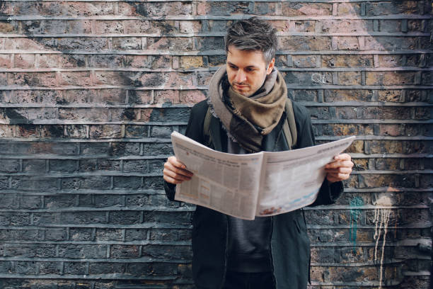 istock Young man reading newspapers on the break 925123046
