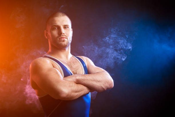 istock Wresler posing on black isolated 925123644
